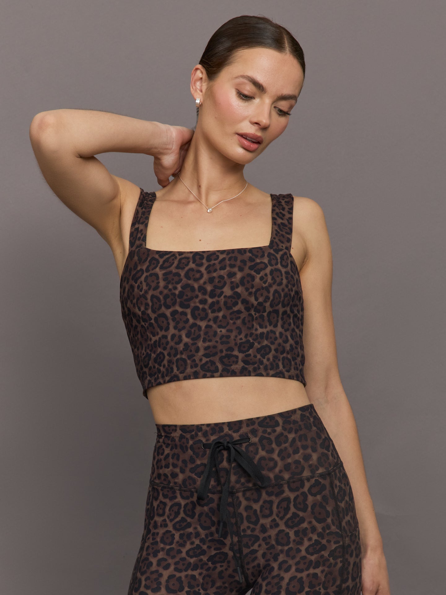 Model wearing Melt Square Neck Bra Leopard Print cropped front view.