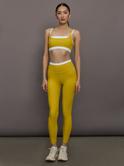 Model is wearing Melt Double-Layered Contrast Bra in Mango Mint/White, full body front view.