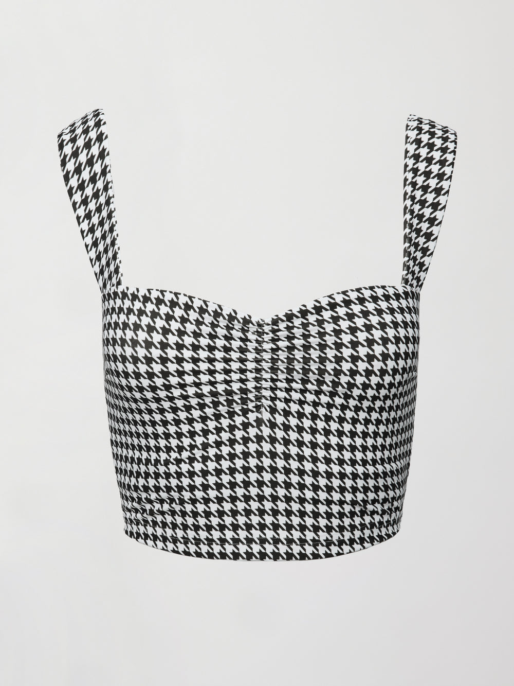 Flat lay of houndstooth sports bra with wide straps and ruched front detail.