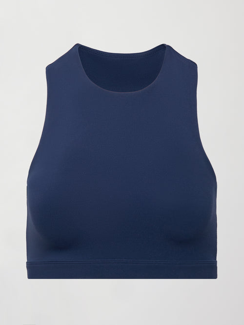 A cropped navy athleisure tank with an asymmetrical racerback. 