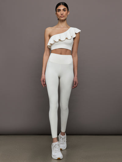 Model wears a highly compressive white high waisted legging. 