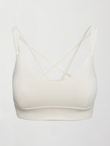 Model wears white active bra with double thin back straps and a smooth, supportive finish.

