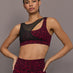 Model is wearing the Mesh Overlay Bra in Red Leopard, front view.
