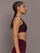 Model is wearing the Mesh Overlay Bra in Red Leopard, side view.