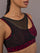 Close-up of the Mesh Overlay Bra in Red Leopard, mesh neckline detail.