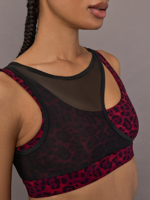Close-up of the Mesh Overlay Bra in Red Leopard, mesh neckline detail.