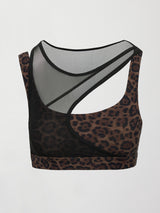 Model wearing a leopard print sports bra with a mesh overlay