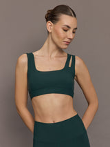 Model is wearing the Cutout Bra in Melt Forest, front view.