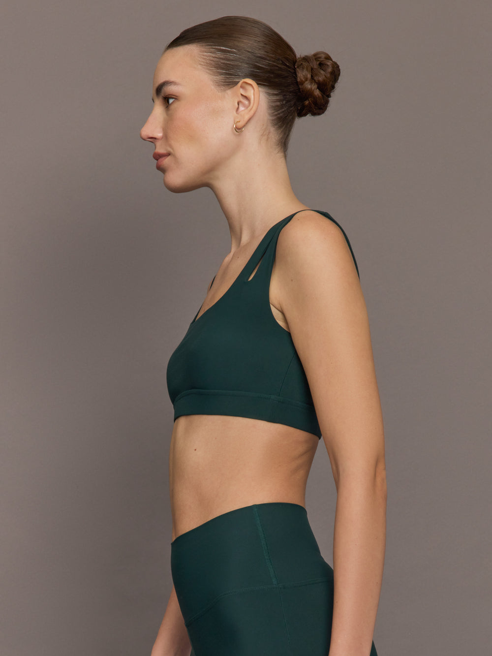 Model is wearing the Cutout Bra in Melt Forest, side profile.