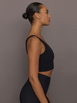 Side view of Rhinestone Bow Bra in Melt Black showing scoop neckline and cropped fit.