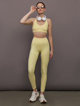 Model is wearing Melt Rib High Rise Legging in Banana, full body styled with matching set.