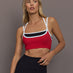 Model is wearing Melt Double Layered Sports Bra in Black, Crimson, and White Binding, front view.