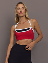 Model is wearing Melt Double Layered Sports Bra in Black, Crimson, and White Binding, front view.