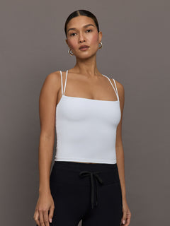 Front view of model wearing Melt Strappy Tank White with double strap detail.