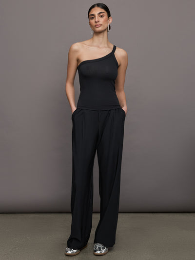 Model wears a black ribbed one shoulder tank.