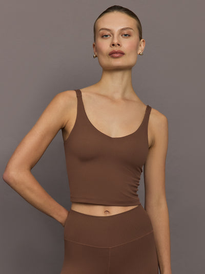 Front view of women’s ribbed melt v-neck tank in cocoa brown, cropped activewear top styled with matching leggings.