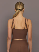 Back view of cocoa brown ribbed melt v-neck tank top, women’s cropped activewear with double adjustable straps.
