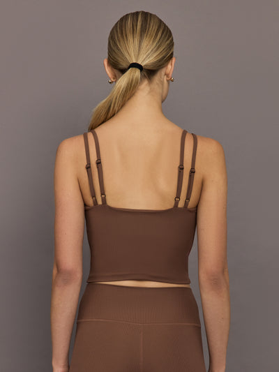Back view of cocoa brown ribbed melt v-neck tank top, women’s cropped activewear with double adjustable straps.