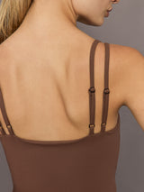 Close-up of adjustable double strap detail on cocoa brown ribbed melt v-neck cropped tank top.