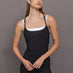 Model wears double-layered melt tank with black outer body and white inner layer.