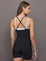 Model wears double-layered melt tank with black outer body and white inner layer.
