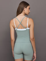 Model wears double-layered melt tank with sage outer body and white inner layer.
