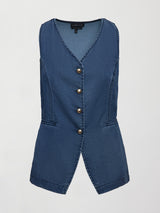 Model wears medium wash vest with a button-down front and sleeveless design.