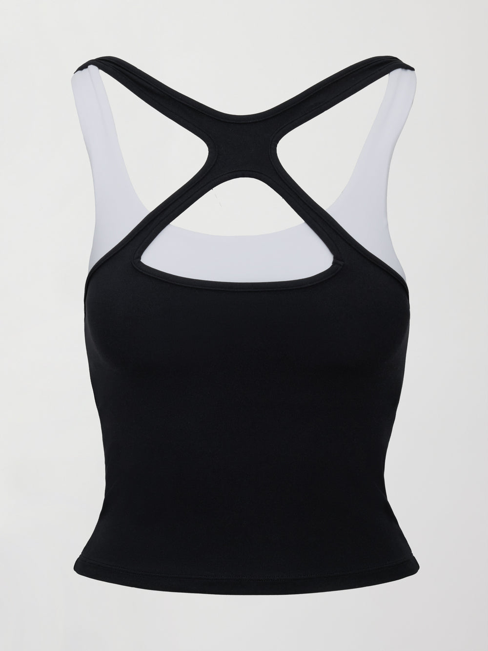 Model wearing a black and white colorblock tank top.
