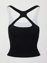 Model wearing a black and white colorblock tank top.
