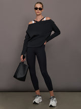 Model wearing a black and white colorblock tank top.
