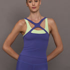 Model wearing blue and green athletic colorblock tank.