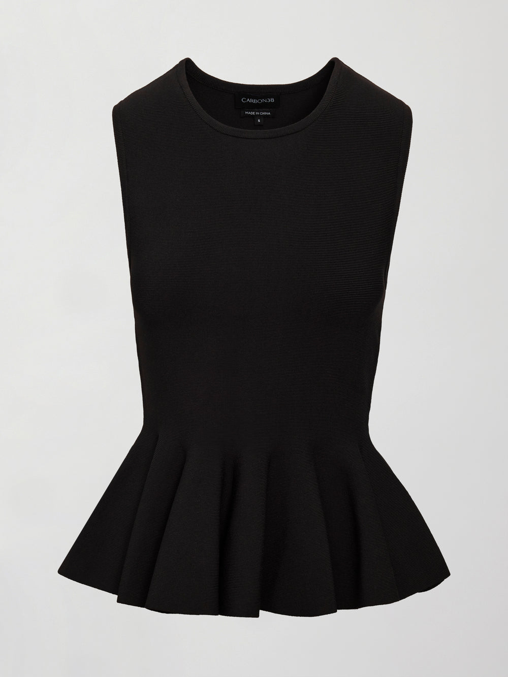 Black peplum top on a light gray background