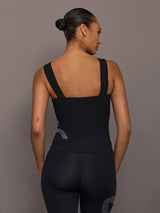 Back view of Rhinestone Bow Tank in Melt Black with wide straps and fitted silhouette.