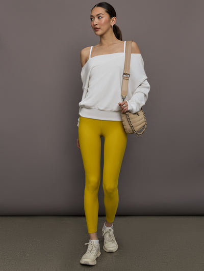 Model is wearing the Melt Ruched Tank in Mango Mint White, full body view.