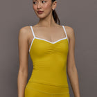 Model is wearing the Melt Ruched Tank in Mango Mint White, front view.