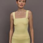 Model is wearing Melt Rib Square Neck Tank in Banana, front view.