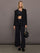 Model is wearing Melt One-Shoulder Cropped Tank in Black, full body styled look.