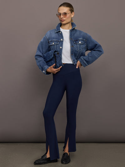 Crop Denim Jacket with Jewel Buttons in Dark Wash styled with white tee, navy pants, and loafers.