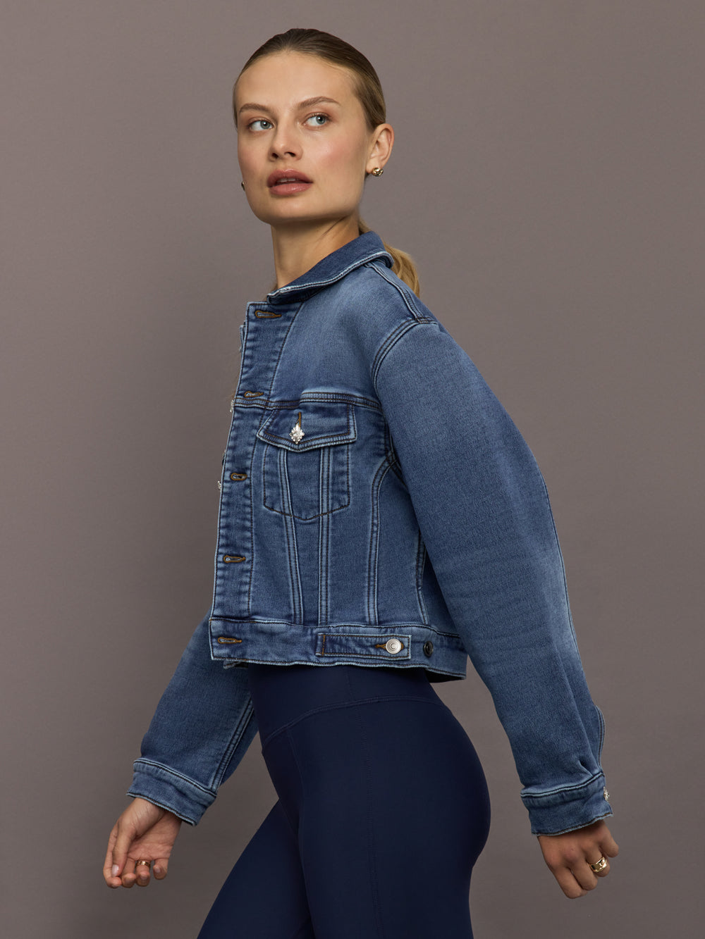 Side view of Crop Denim Jacket with Jewel Buttons in Dark Wash highlighting cropped fit.