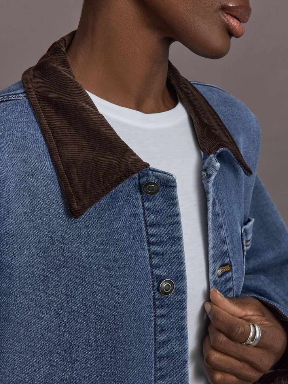 Close up of the Denim Barn Jacket in Dark Wash showing corduroy collar detail.