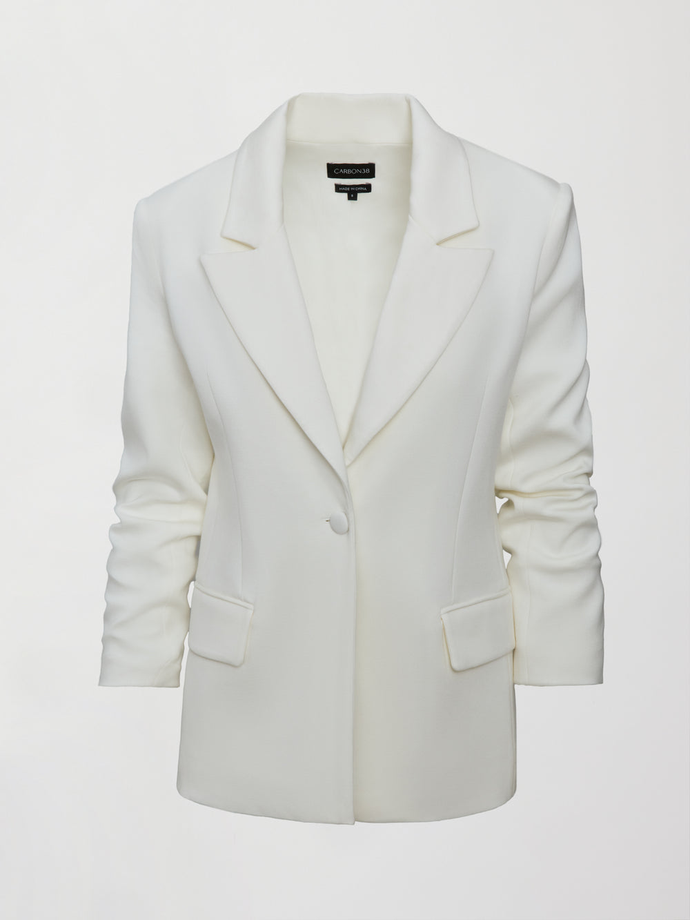 Model wearing an Ivory single breasted blazer.