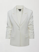 Model wearing an Ivory single breasted blazer.