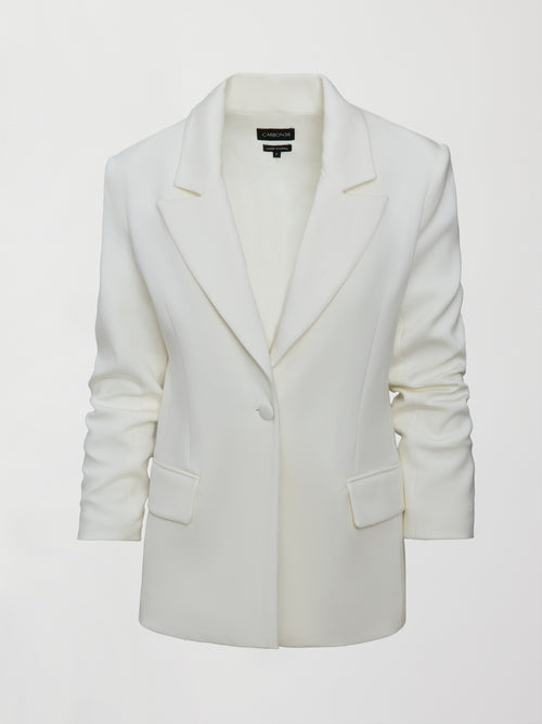Model wearing an Ivory single breasted blazer.