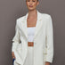 Model wearing an Ivory single breasted blazer.