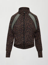 Model wearing a leopard print jacket with sheer panels.