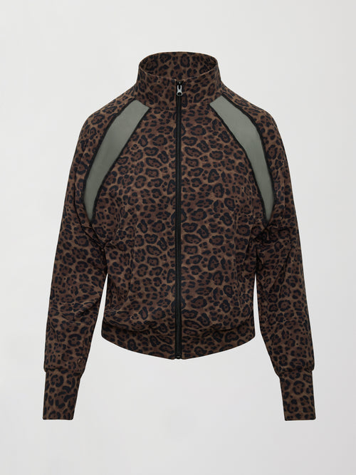 Model wearing a leopard print jacket with sheer panels.