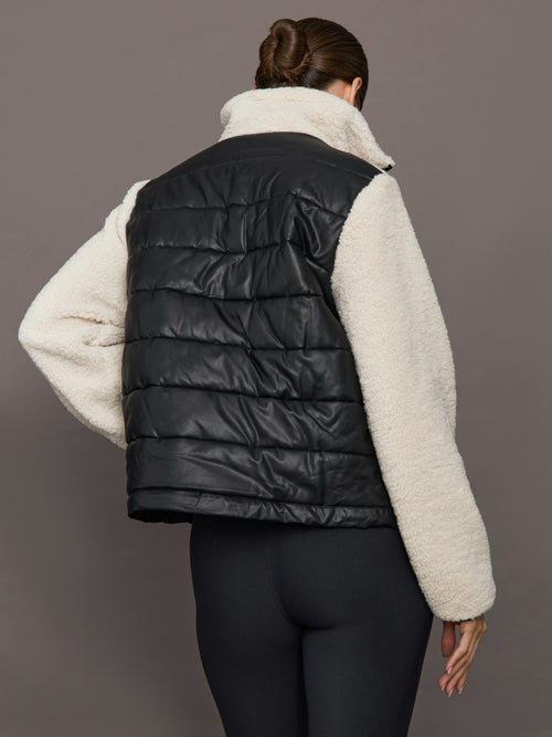 Faux Leather Sherpa Jacket in natural sherpa with quilted black faux leather back panel, back view.