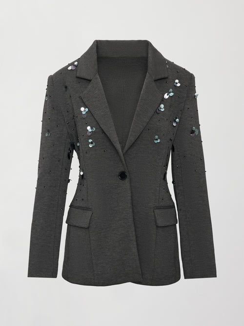 Flat lay of grey embellished blazer with sequins and front button closure.