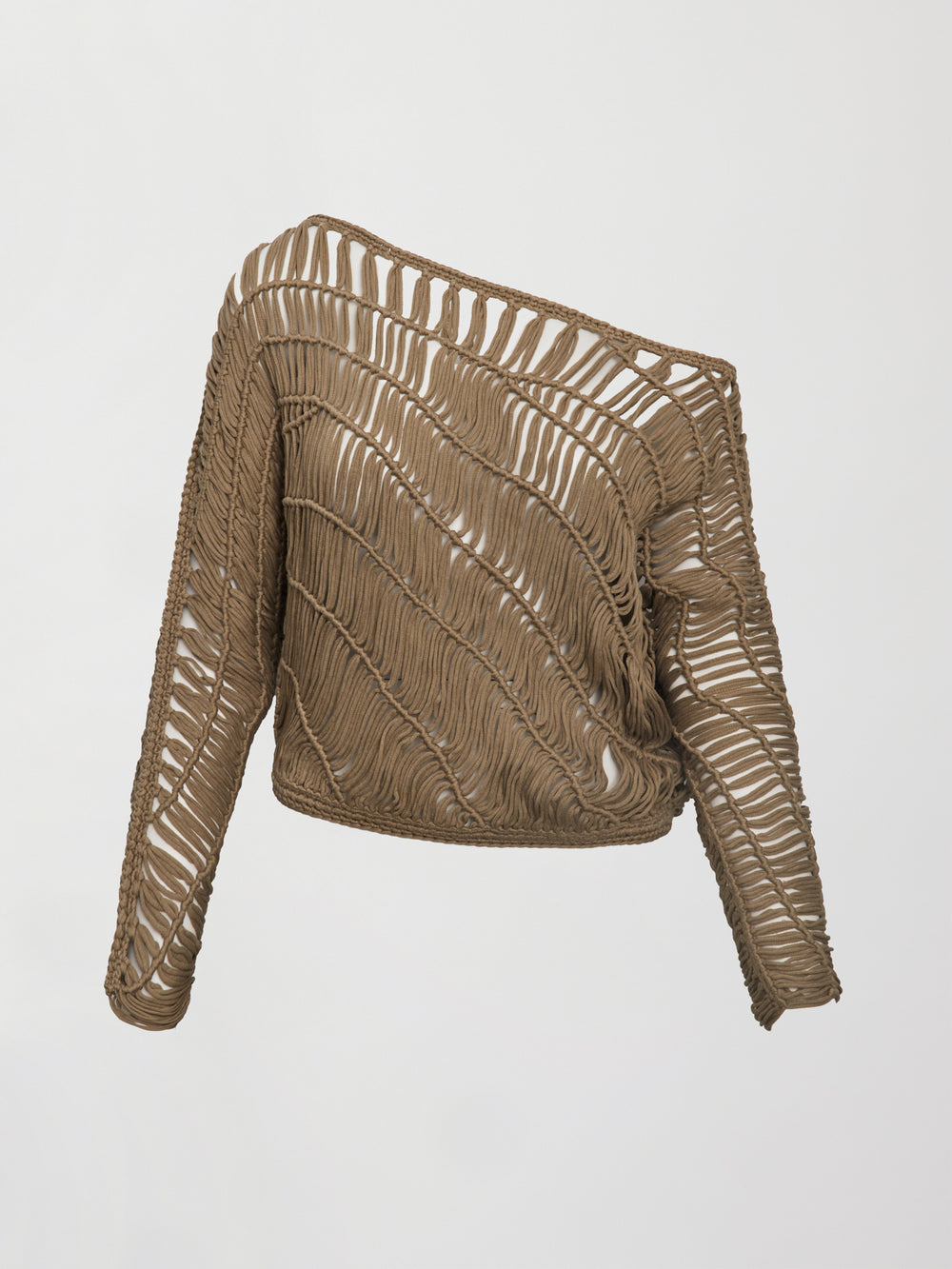 A crocheted one shoulder sweater in light brown.