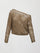 A crocheted one shoulder sweater in light brown.